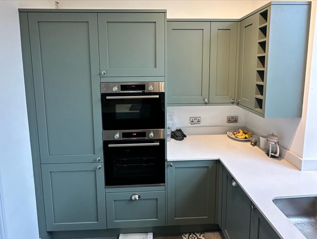 A fully installed, modern kitchen with a clean, stylish aesthetic, courtesy of ProCut Carpentry in Peacehaven.