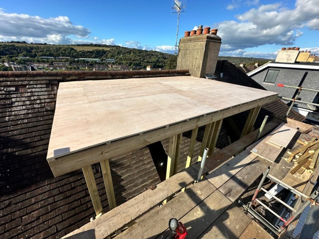 Initial structural work on a loft conversion for a Brighton HMO, including steel beam installation by Procut Carpentry.