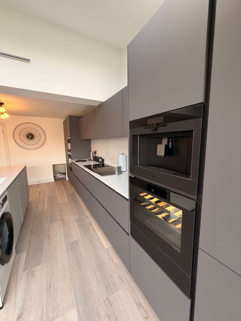 Custom kitchen installation with tailored cabinetry and worktops by Procut Carpentry.