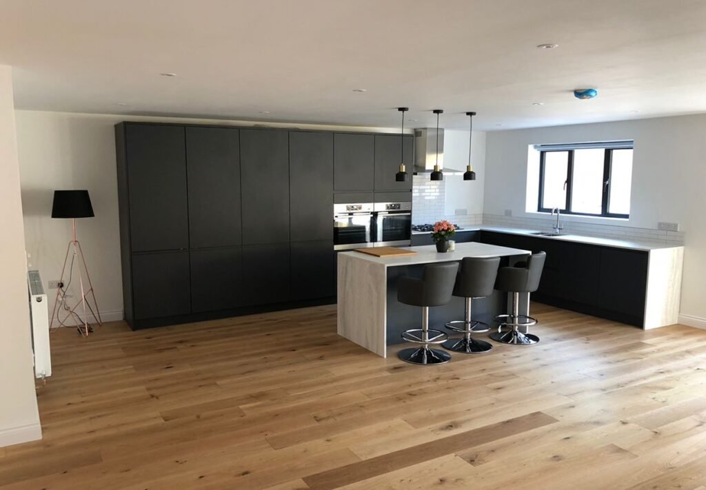 Finished kitchen featuring a stylish central island and sleek units in a Brighton home, designed by Procut Carpentry.