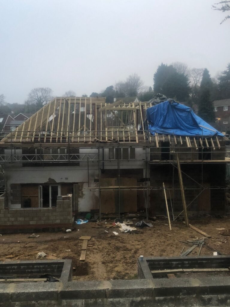 A detailed shot of the hand-cut roof in progress, showcasing the craftsmanship and structural integrity in a Brighton home.