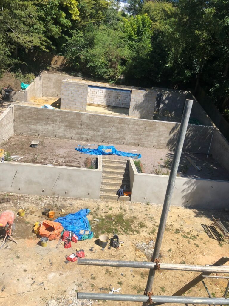 Top-view of custom cladding applied to a summer house in Brighton, providing modern visual appeal and weather protection.