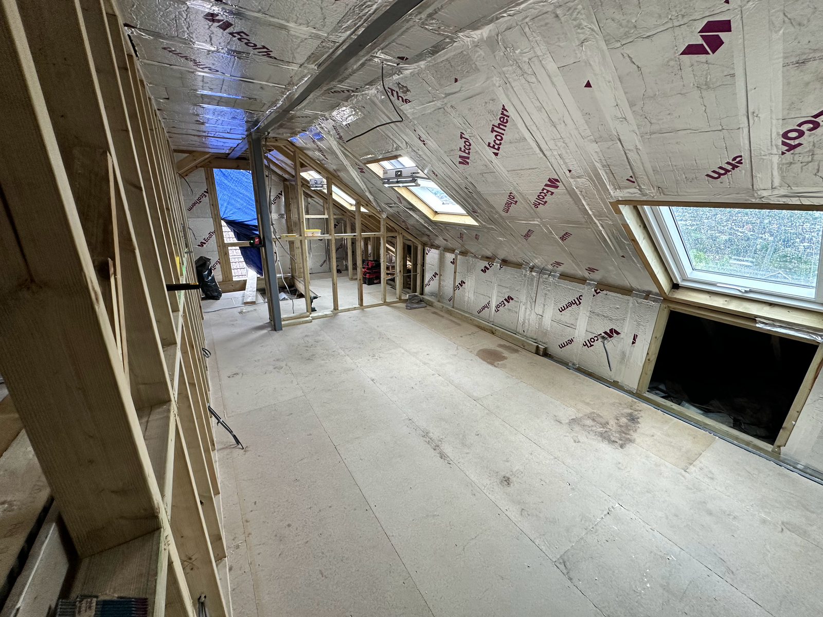 Composite cladding and window installation in the Saltdean loft conversion, bringing natural light and a contemporary finish