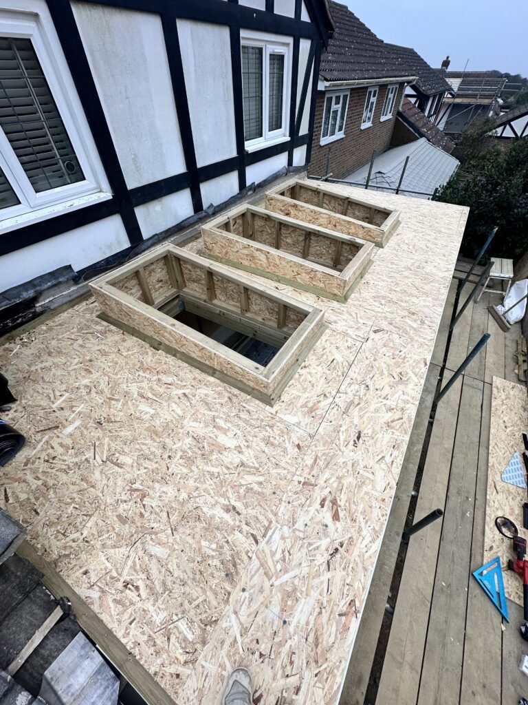 Stylish flat roof installation with skylights in Peacehaven by Procut Carpentry.