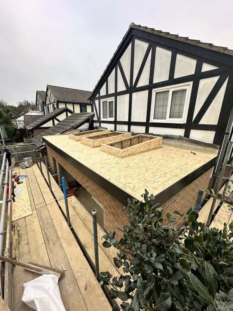 Precision skylight fitting on a flat roof for an extension in Peacehaven by Procut Carpentry.