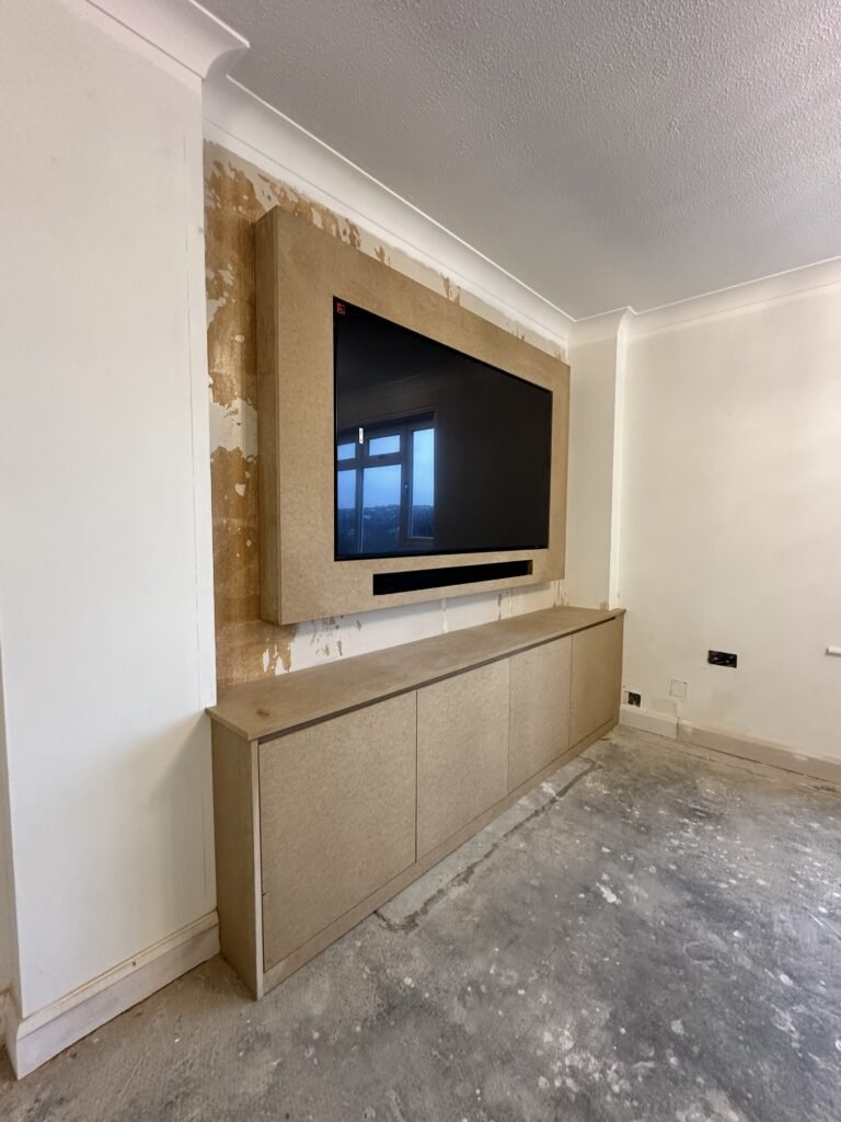 Minimalist and sleek media wall installed in Varndean living room.