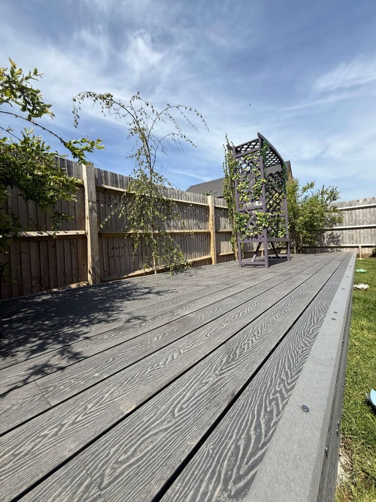 Composite decking in Lancing backyard designed for easy cleaning and upkeep.
