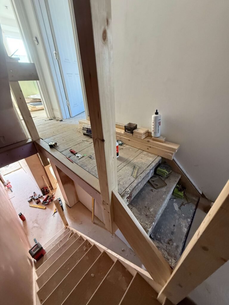 Timber handrail and spindle detailing showcasing bespoke joinery by Procut Carpentry in Hove.