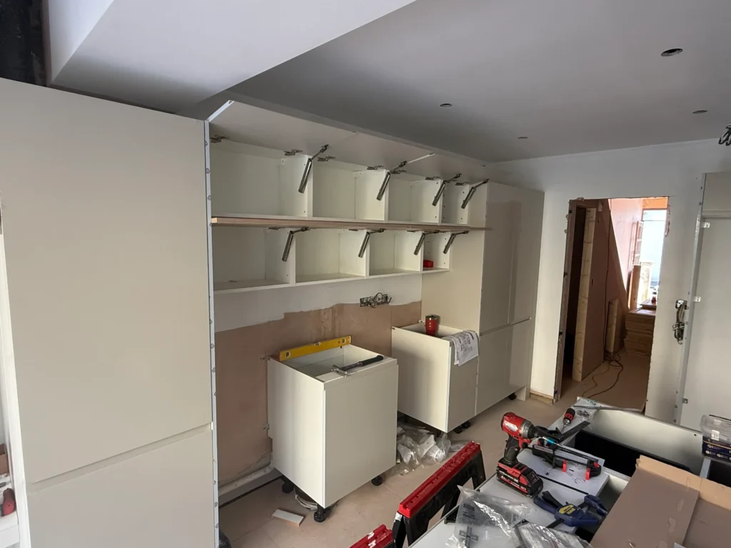 Corner cabinetry designed to maximise space in Howdens kitchen by Procut Carpentry.